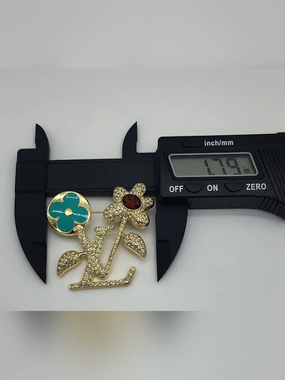 LOUIS VUITTON Crystal LV Flower Brooch GoldTone Turquoise Red Zipper Hardware